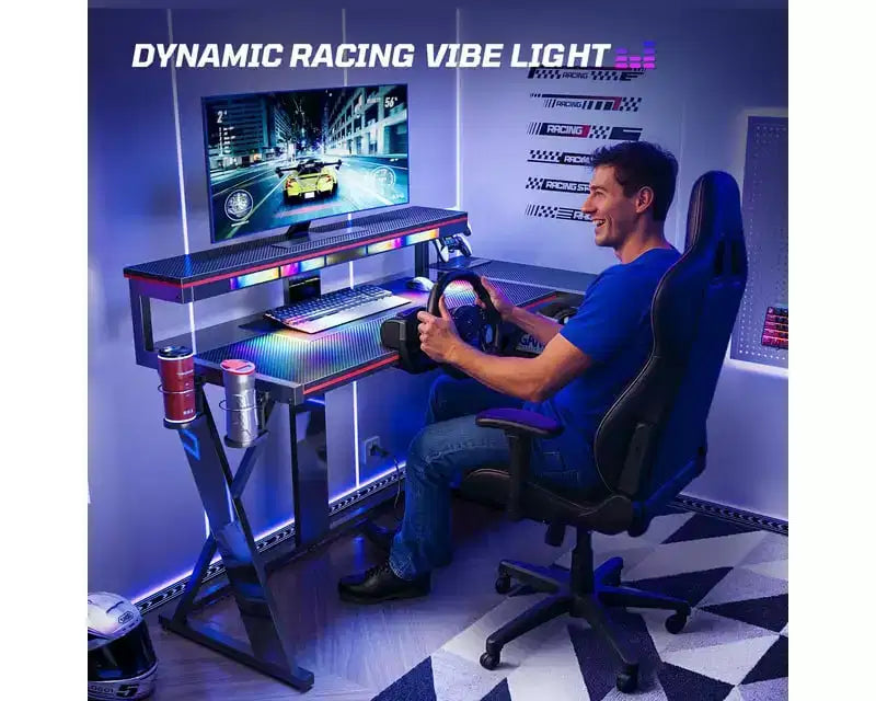 Bestier Bureau Gamer en Forme de L de 105,6 cm/144,8 cm avec Support Moniteur et Prise de Courant, Bureau d'Angle d'Ordinateur LED avec Porte-Gobelet et Support Manette