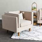 Fauteuil Atley moderne rembourré à accoudoirs hauts avec pieds en bois massif