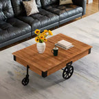Table basse industrielle rustique Vintiquewise en bois, de grande taille, avec grain de bois détaillé, accents métalliques et roues de chariot en fonte noire