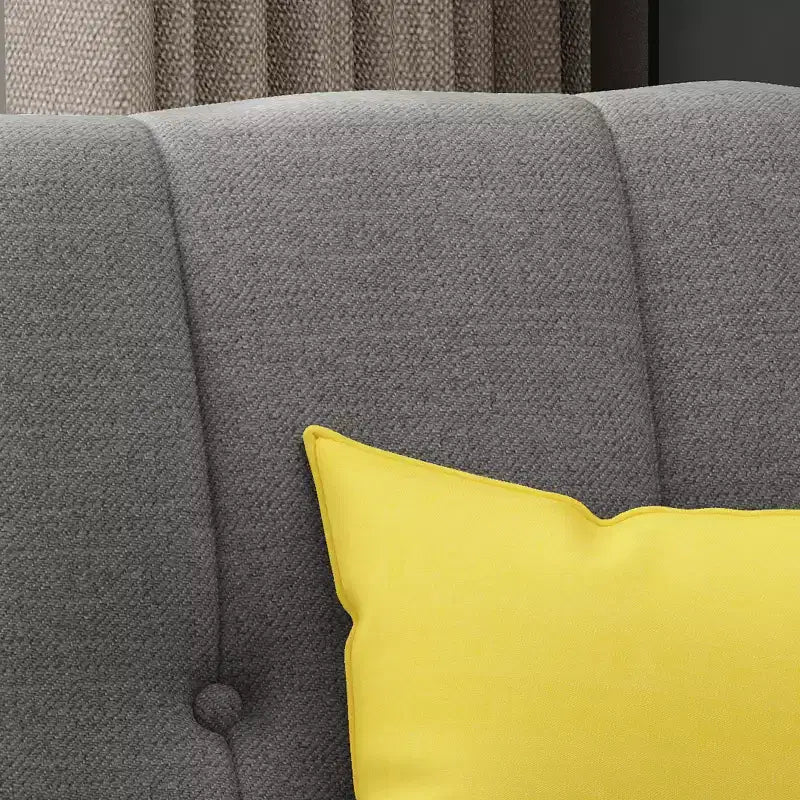Fauteuil club capitonné en tissu avec passepoil Angelina Mid-Century GDFStudio