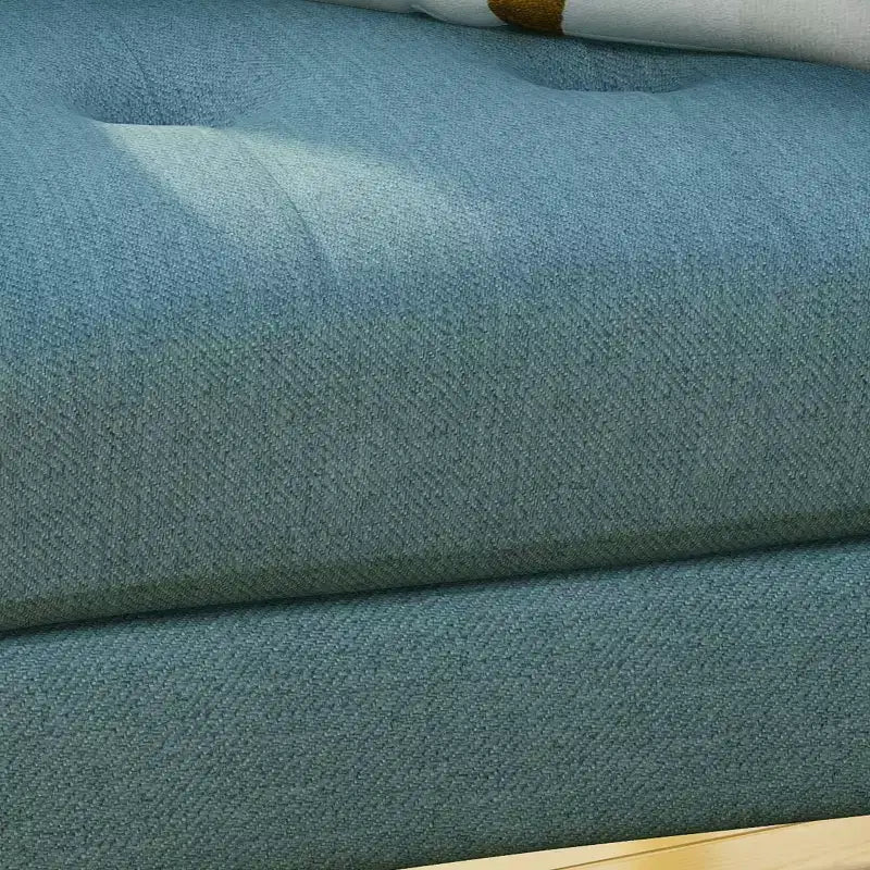 Fauteuil club capitonné en tissu avec passepoil Angelina Mid-Century GDFStudio