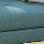 Fauteuil club capitonné en tissu avec passepoil Angelina Mid-Century GDFStudio