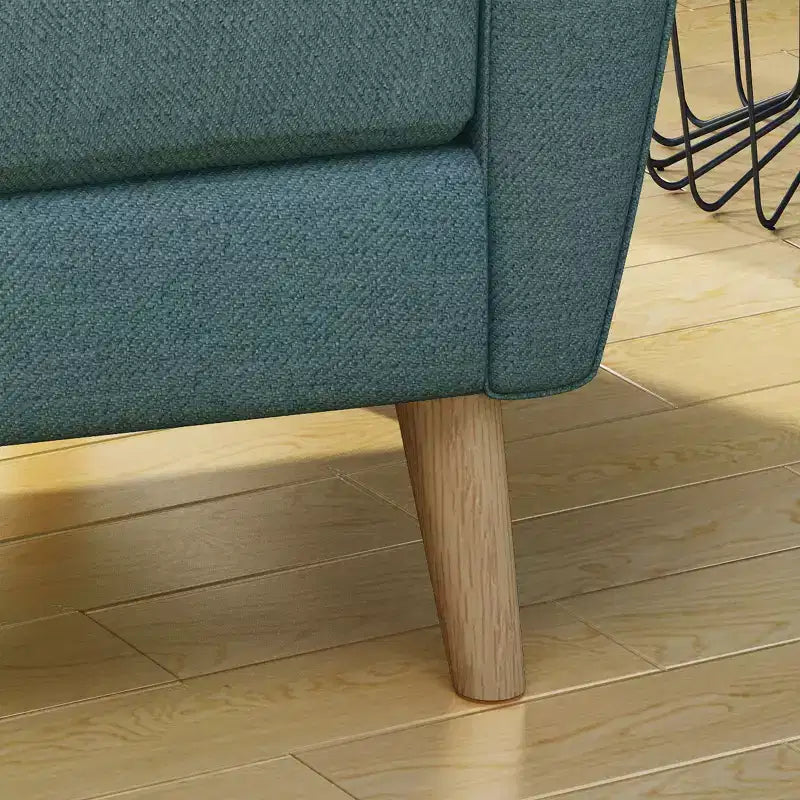 Fauteuil club capitonné en tissu avec passepoil Angelina Mid-Century GDFStudio