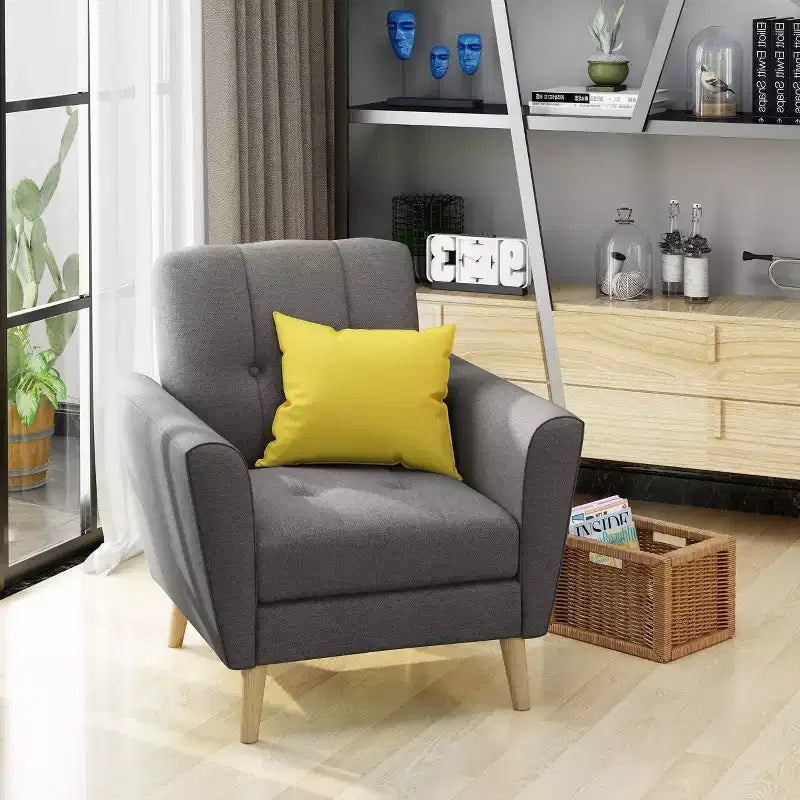 Fauteuil club capitonné en tissu avec passepoil Angelina Mid-Century GDFStudio