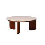 Table basse ronde GDFStudio Bellamy en bois massif avec plateau en pierre frittée